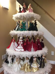 a christmas tree made out of barbie dolls