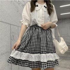 Plaid Ruffle Lolita Dolly Skirt/Shirt Plaid Ruffle Lolita Dolly Skirt. White lolita shirt with bow decoration. Available for purchase separately or as a set. Blouse- One Size Bust: 100cm Length: 58cm Skirt- One Size Waist: 60-90cm Length: 46cm Summer Kawaii Ruffled Skirt, White Cotton Harajuku Style Skirt, School Skirt With Cotton Ruffles, School Skirt With Ruffles In Cotton, White Harajuku Style Ruffled Skirt, White Harajuku Skirt With Ruffles, Cute Ruffled Skirt For School, Casual Ruffled Tops For School, Harajuku Style Ruffled Tops