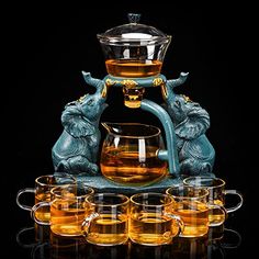 PRICES MAY VARY. ❤【QUALITY MATERIAL】This beautiful teapot set is made of transparent borosilicate glass, which has excellent heat resistance and durability. Making them perfect for use with blooming tea. ❤【MASTERFUL DESIGN】Specially designed gooseneck type non-drip water outlet, smooth water flow. It can effectively prevent water from splashing out.High-quality handle, firm grip, easy to hold and easy to dump. ❤�【AUTOMATIC WATER INJECTION】The glass teapot with a removable infuser automatic draws Glass Tea Set, Blooming Tea, Coffee Server, Teapot Set, Tea Maker, Glass Teapot, Bar Supplies, Fruit Tea, Tea Pot Set