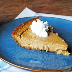 a slice of pumpkin pie on a blue plate