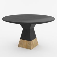 a round table with black top and wooden base on an isolated white background for display or montage