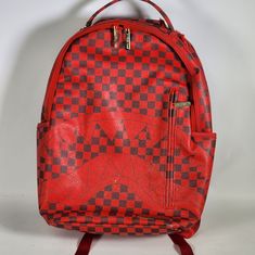 Sprayground X Todd Gurley Sharks In Paris Red Checkerboard Backpack Used But In Good Working Condition Spay Ground Backpack Product Details Exterior Dimensions: 18" X 6" X 11.5" Front Zipper Pocket Side Pockets Zippered Stash Pocket Ergonomic Mesh Back Padding Adjustable Straps For Custom Sizing Nylon Zippers With Metal Hardware Metal "Sprayground Authentic" Badge Slide Through Back Sleeve Connects To Carry On Luggage To Free Your Hands Interior Separate Laptop Compartment Separate Velour Sunglass Compartment Mesh Organizer Pocket Sprayground Is A Brand That Specializes In Creating Unique And Stylish Backpacks, Luggage, And Accessories. It Was Found Sprayground Backpack, Todd Gurley, Brand Collaboration, Stylish Backpacks, Carry On Luggage, Metal Hardware, Christmas List, Travel Bags, Front Zipper