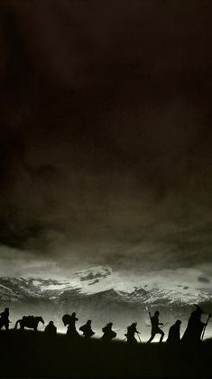 silhouettes of people and horses against a dark sky with waves in the background,