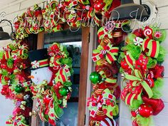 a christmas wreath is hanging on the front door