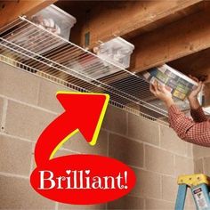 a man is working on the ceiling in his garage with an arrow pointing to brilliant