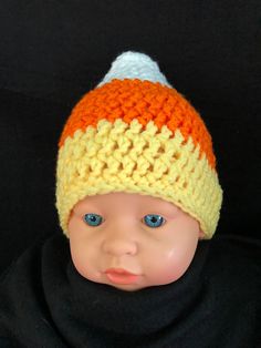 The perfect gender neutral hat for fall weather, Halloween or anytime . . . and adorable baby photos! Cute hat design is hand crocheted to resemble candy corn in wide striped colors of white, orange and yellow . Large white flower (white flower with orange center) option is available in all sizes. Available in 7 sizes . . . ranging from Newborn baby to Adult Made to order item . . . NOTES: I try to get the best photos that represent the true color but at times color(s) may vary slightly due to p Candy Corn Beanie Crochet Pattern, Crochet Candy Corn Dress, Large Crochet Candy Corn, Crochet Infant Candy Corn Hat Pattern, Corn Photo, Candy Corn Hat, Neutral Hats, Hat Halloween Costume, Baby Candy