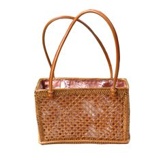 Rattan Top Handle Shoulder tote is the perfect addition to your bag collection. Features a fully lined drawstring closure batik print 100% cotton lining. Perfect to carry your keys, wallet, phone and other essentials. (PRODUCT INFO): Material: Rattan/Ata Size: 6" H x 9" L x 4" D inches Fully lined interior-100% cotton batik print Drawstring closure (SHIPPING INFO): All our items are made-to-order, therefore please allow 3-5 business days for production. Our goal is to become more sustainable throughout our production process, reducing overproduction and maintaining responsible stock levels. Thank you for your patience in supporting our mission. Thank you for choosing to support sustainable shopping! We value your support. Casual Light Brown Rectangular Beach Bag, Everyday Tote Beach Bag With Mobile Phone Bag, Everyday Tote Beach Bag With Mobile Phone Pocket, Daily Use Beach Tote With Mobile Phone Bag, Rectangular Light Brown Beach Bag For Travel, Brown Straw Bag With Mobile Phone Pocket For Travel, Brown Straw Travel Bag With Mobile Phone Pocket, Brown Handheld Beach Bag With Bamboo Handle, Handheld Brown Beach Bag With Bamboo Handle