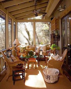 the sun shines through the windows in this room with wicker furniture and chairs