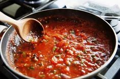 a pan filled with sauce on top of a stove