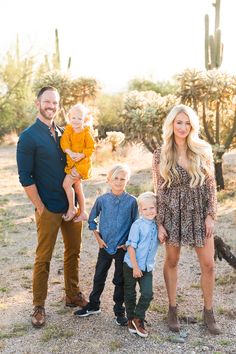 a family posing for a photo in the desert