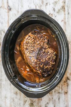 the meat is cooked in the crock pot and ready to be served into the slow cooker