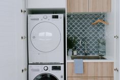 a washer and dryer in a small room