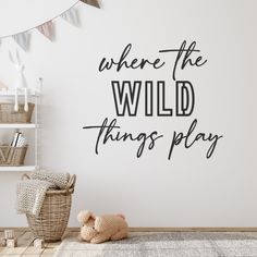 there is a wall sticker that says, where the wild things play