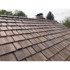 the roof of a house with wood shingles