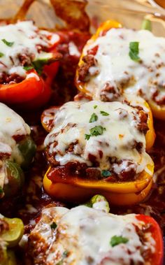 stuffed bell peppers with meat and cheese in a casserole dish