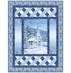 a blue and white quilted wall hanging with a church in the snow on it