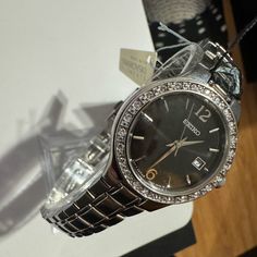 Seiko Sur785 Women's Silver Black Dial Swarovski Crystals Bezel Dress Watch Very Good Condition No Scratches On The Crystal With New Battery Just Replaced All Extra Links Included With Original Box And Tags No Papers Dress Watch, Accessories Watches, Black Silver, Swarovski Crystals, Original Box, Women Accessories, Crystals, Tags, Silver