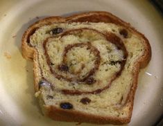 there is a piece of bread that has been swirled with chocolate chips on the side