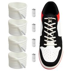 four pairs of white and black shoes with laces on the bottom, one shoelaced