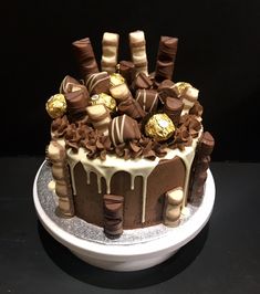 there is a cake with chocolate and candy on it