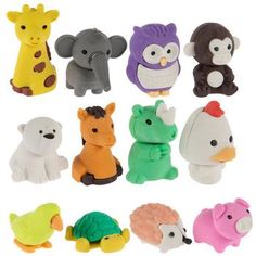 an assortment of various toy animals on a white background