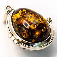 925 solid sterling silver. Baltic amber is a natural 44 million years old gemstone. Each genuine Baltic amber gemstone is unique; color variations are proof of quality and authenticity, not a defect. Detailed dimensions Length 1.4 inch Width 0.9 inch Height 0.6 inch Total weight 12 g Oval Baltic Amber Necklace For Gifts, Amber Pendant Locket Jewelry, Polished Baltic Amber Pendant Jewelry, Vintage Amber Sterling Silver Necklace, Silver Baltic Amber Pendant Necklace, Amber Gemstone, Baltic Amber, Fine Jewellery Necklace, Locket