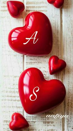 three red hearts with the letter s on them