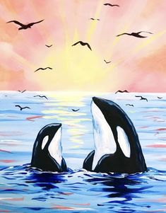 two black and white orca whales in the ocean with birds flying above them at sunset