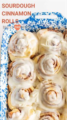 a pan filled with cinnamon rolls covered in icing