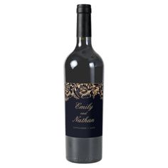 a bottle of red wine with gold sprinkles on the top and bottom