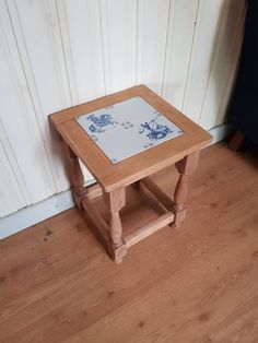 Beautiful oak handmade side table. Made around the 1940s when it was popular to incorporate antique ceramic tiles in furniture. Original dark lacquer has been sanded off so that the color of the wood is clearly visible. The table is very sturdy and robust. The tiles are slightly damaged (see photos) The blade is treated with varnish to prevent stains. Typically Dutch Dimensions: Width: 33 cm Depth: 33 cm Height: 43 cm The side table will be well packed and shipped. For the sake of the environmen Country Side, Delft Blue, Antique Ceramics, Blue Tiles, Coffee And End Tables, Delft, Step Stool, Ceramic Tiles, End Tables