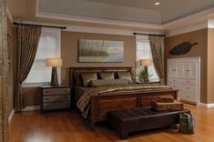 a large bed sitting in the middle of a bedroom