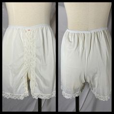 This is a Brufke brand pair of white nylon tap shorts. Lace trimmed. In overall good vintage condition with some loose threads.  Size Small (shown on a size 4 dress form) Measurements  Waist unstretched  20" - full stretch 36" Hips 38" Rise 12" Inseam 3" Loc h/s/s/c White Bottoms With Built-in Shorts For Daywear, White Stretch Shorts For Daywear, Stretch Vintage Bottoms With Lace Trim, Vintage Stretch Bottoms With Lace Trim, Vintage Style Stretch Bottoms With Lace Trim, Stretch Lace Trim Shorts For Daywear, White Lace Trim Bottoms For Daywear, Vintage Stretch Short Length Bottoms, Mid-thigh Length Shorts For Daywear