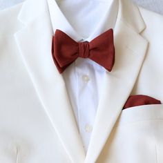 Tie Mood's Cinnamon collections comes with adult regular and big and tall skinny cotton neckties.  Matching adult self-tie and pre-tied bow ties, kid's pre-tied bow ties and pocket squares for a complete set.  Perfect for the bridal party to mix and match. Matches closely to David's Bridal Cinnamon Color:  Cinnamon / Burnt Orange Imported and Handmade Material:  100% Cotton www.tie-mood.com Adult Cinnamon Floral (solid front with floral tail):  Width:  approx. 2.75 inches   Length:  approx. 58 i Dapper White Ties For Grooms, Dapper White Ties For Groom, Dapper White Tie For Groom, Classic Red Suit And Tie Accessories For Groom, Classic White Tie For Groom, Classic White Ties For Groom, Fitted Red Bow Tie For Wedding, Classic White Bow Tie For Wedding, Red Standard Tie For Wedding