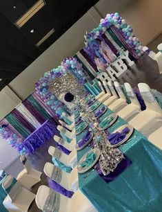 the table is decorated with purple and blue decorations