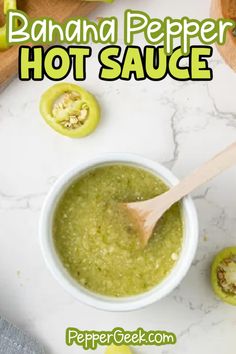 a bowl filled with hot sauce next to sliced green peppers