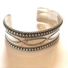 Wonderful Sterling Silver cuff bracelet by Navajo artist: Ron Y. It weighs 50 grams. The inside tip to tip is 5 1/8 inches. The around outside of bracelet is 5 7/8 inches The gap/opening is 1 3/8inches. The width is 7/8 inch. It is signed RON Y. Stamped Sterling. Striking design and quality craftsmanship. Great vintage condition. All items are packed carefully and shipped with tracking. Thanks for looking!! Southwestern Engraved Cuff Bracelet As A Gift, Southwestern Polished Cuff Bracelet As Gift, Adjustable Traditional Cuff Bracelet With Polished Finish, Traditional Adjustable Cuff Bracelet With Polished Finish, Bohemian Polished Finish Cuff Bracelet As Gift, Bohemian Cuff Bracelet With Polished Finish As Gift, Sarah H, Navajo Turquoise, Vintage Navajo