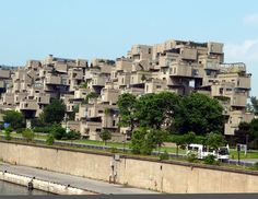 a very tall building with lots of windows and balconies on the top of it