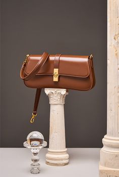 MATERIAL - Made of 100% high quality cowhide split leather, solid color,feels cosy to touch,delicate, durable. The hardware parts are made of cast molding thick hardware, top metal hardware. The stitching is well-made, firm and smooth.DIMENSIONS - 10.2L*2W*4.7H(inches) / 26L*5W*12H(cm).STRUCTURE - This shoulder bag contains 1 main compartment, 1 inner slip pocket, 1 inner zipper pocket. Comfortably holds wallet, mobile phone, cosmetics, keys, charge, essentials and so on.FUNCTIONAL - Come with a Luxury Leather Shoulder Bag In Solid Color, Modern Brown Bag With Turn-lock Closure, Leather Baguette Bag With Metal Hardware For Everyday Use, Classic Baguette Bag With Metal Hardware For Daily Use, Elegant Brown Satchel With Metal Hardware, Timeless Brown Satchel With Metal Hardware, Classic Baguette Bag With Metal Hardware, Leather Baguette Bag With Metal Hardware For Travel, Square Leather Bag With Hasp Closure