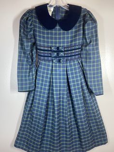 "Adorable winter weight dress  / labeled sz 7 girls / measures pit to pit 14\"/ elastic back waist 12 1/2\"-13 1/2\"comfortably / pit to wrist 13 1/4\" / length (shoulder to bottom) 35\"/ slightly puff sleeves & velvet sleeve wrist piping & collar / Smoke free environment - No issues (97)" Vintage Plaid Dress For Winter, Vintage Plaid Winter Dress, Fitted Plaid Preppy Dress For Fall, Fitted Plaid Dress For Fall In Preppy Style, Fitted Plaid Dress For Fall, Preppy Style, Fitted Retro Plaid Dress For Fall, Vintage Plaid Dress For Fall, Preppy Gingham Dress For School, Preppy Plaid Dress For Fall