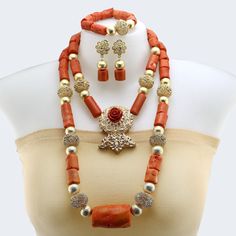 Main Material: Coral  Length:Inner necklace 18inch Items included: Necklace / Bracelet/Earrings All items are by handmade, it need to take about 3-5 days to make it . Add a touch of African elegance to your wedding ensemble with our exquisite African Coral Bead Jewelry Set. This set features a stunning necklace adorned with traditional Nigerian coral beads, carefully crafted to capture the essence of cultural heritage. The jewelry set beautifully combines tradition with contemporary style, making it perfect for your special day. Embrace the rich symbolism and timeless beauty of Nigerian wedding jewelry with this remarkable necklace. Luxury Jewelry With Natural Stones And Red Coral, Luxury Jewelry With Red Coral And Natural Stones, Luxury Large Beads Red Coral Jewelry, African Elegance, Nigeria Wedding, Coral Jewelry Set, Orange Necklace, Wedding Jewelry Set, Natural Coral