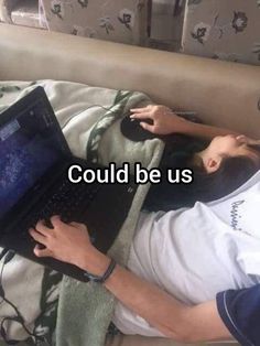 a man laying in bed using a laptop computer with the words could be us on it