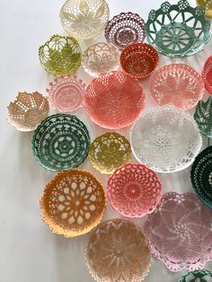 there are many different colored doily on the table