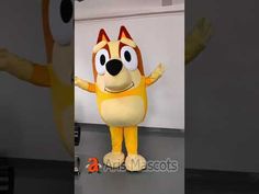 an image of a dog mascot standing in front of a wall with his arms out