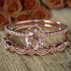 two rose gold wedding rings with an oval morganite