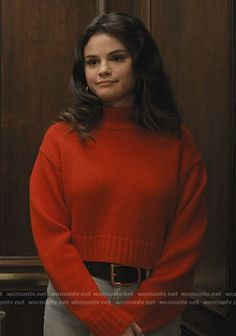 an image of a woman wearing a red sweater