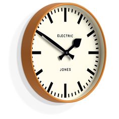 a white and gold clock with black hands on a white background, reads electric jones