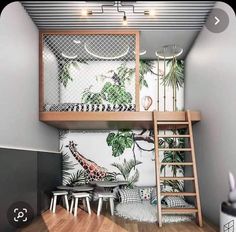 there is a loft bed with a giraffe mural on the wall next to it