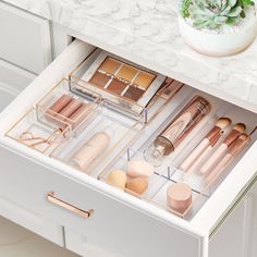 an open drawer with makeup products in it and the words professional organizers written on top