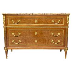 an antique chest of drawers with marble top and brass hardware on the bottom drawer,